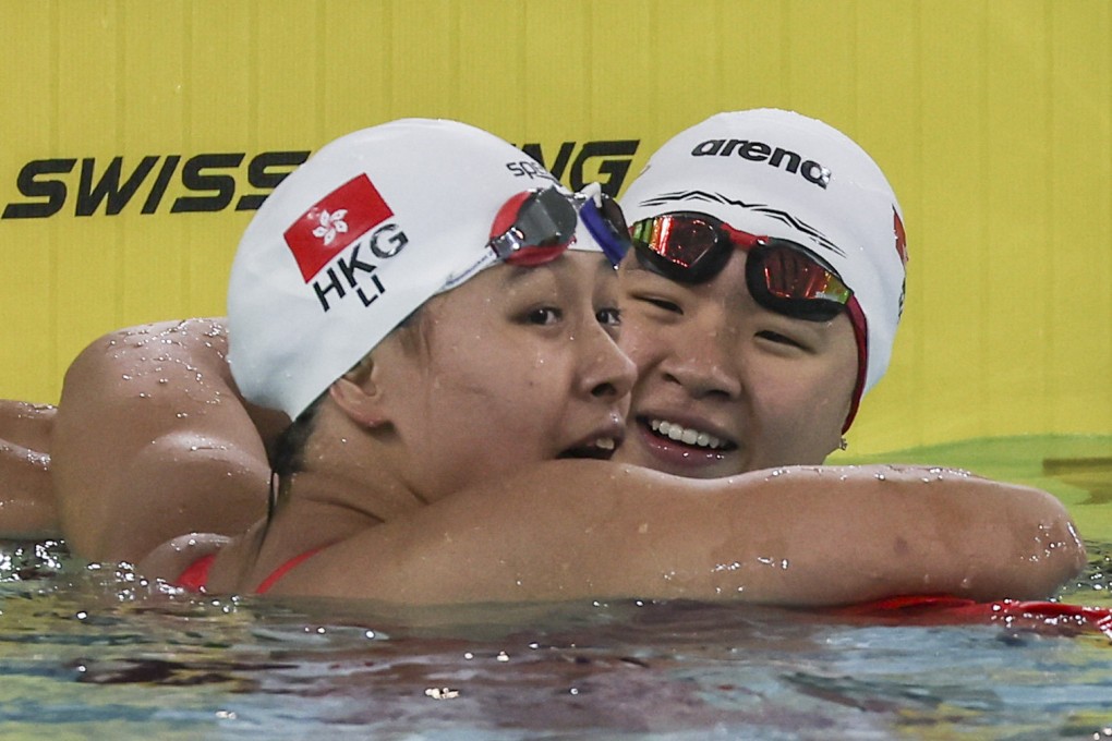 Li Sum-yiu (left) and Gilaine Ma compare notes after the 200m freestyle at Victoria Park. Photo: Edmond So