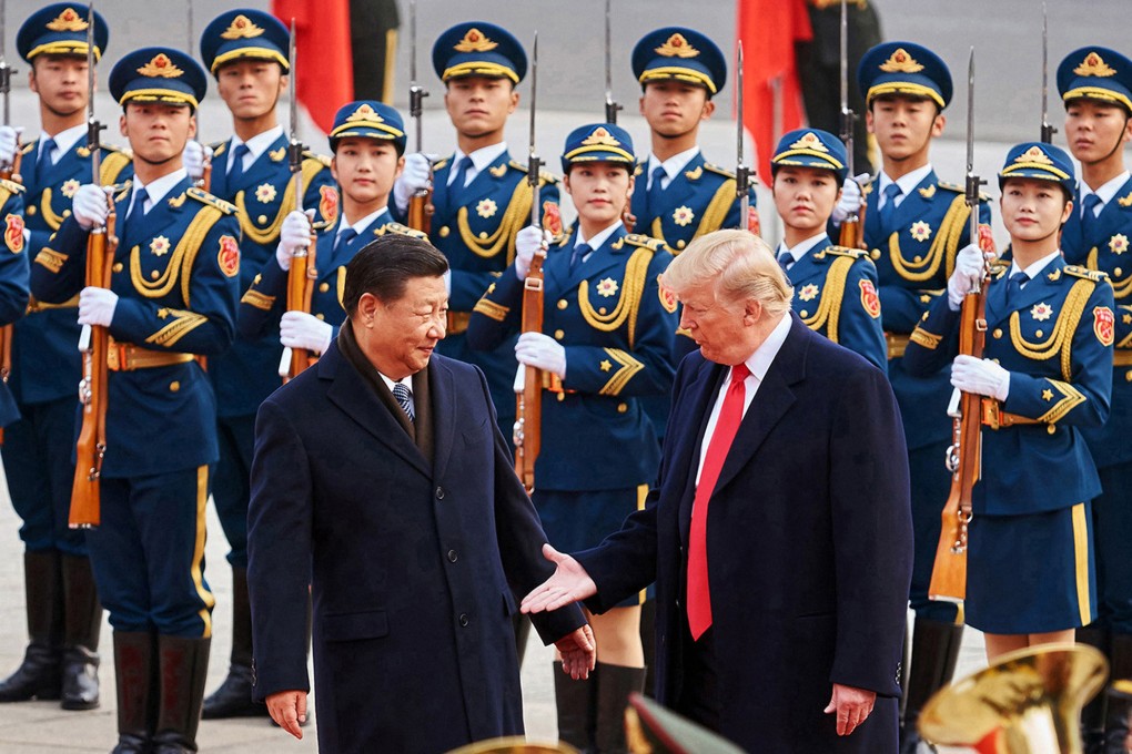 From left, China’s President Xi Jinping and then-US President Donald Trump shake hands on November 9, 2017, during a meeting outside the Great Hall of the People in Beijing. Photo: TNS