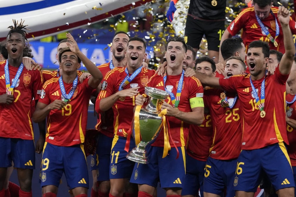 Spain captain Alvaro Morata starts the Euro 2024 trophy celebrations after their final victory over England. Photo: AP