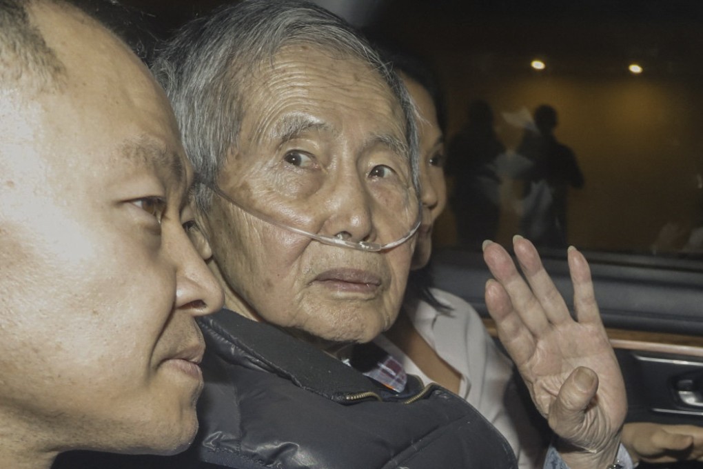 Former Peru president Alberto Fujimori sits between his children Kenji and Keiko upon his release from prison in Lima, Peru on December 6. Photo: AFP