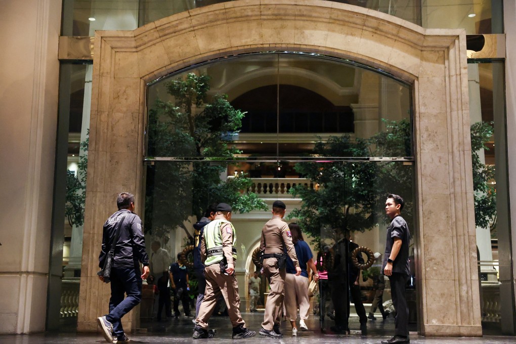 Policemen walk inside Bangkok’s Grand Hyatt Erawan hotel, where six people were believed to have been reported dead. Photo: Reuters