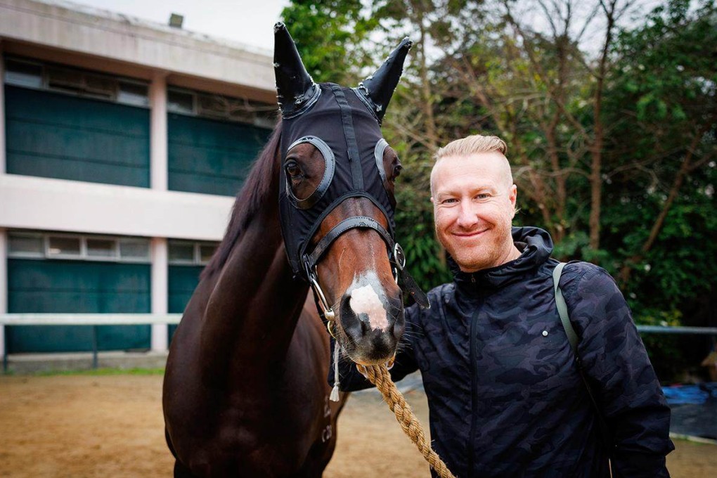 American horse racing photographer Alex Evers with champion racehorse Golden Sixty in Hong Kong. The Media Eclipse Award winner talks about capturing the best moments in Hong Kong horse racing and why Happy Valley Racecourse “never gets old”. Photo: Hong Kong Jockey Club