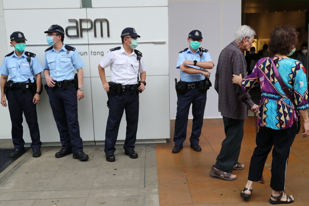 Police officers on duty outside APM shopping centre in Kwun Tong, where anti-government protesters gathered for a lunch hour demonstration in 2019. Photo: Edmond So