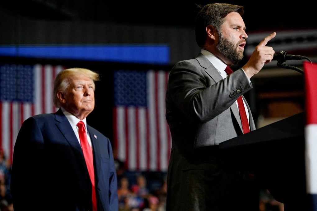 Former US president Donald Trump listens as JD Vance speaks during a rally in Youngstown, Ohio, in 2022.  Photo: Reuters