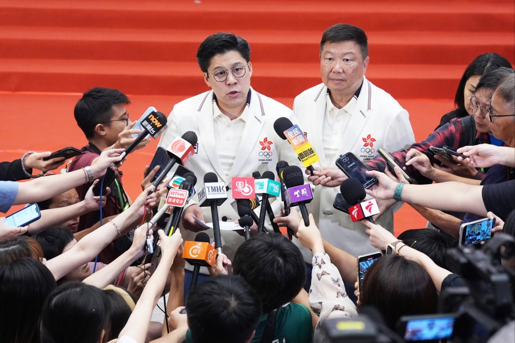 Lawmaker Kenneth Fok (centre) attended the meeting with swimming officials. Photo: Eugene Lee