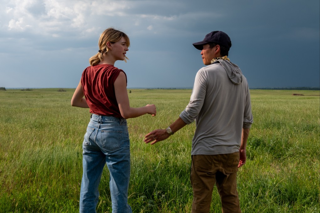 Lee Isaac Chung with Daisy Edgar-Jones on the set of Twisters. The Korean-American director talks about drawing on his experiences with extreme weather in the American Midwest to make the summer blockbuster. Photo: Melinda Sue Gordon