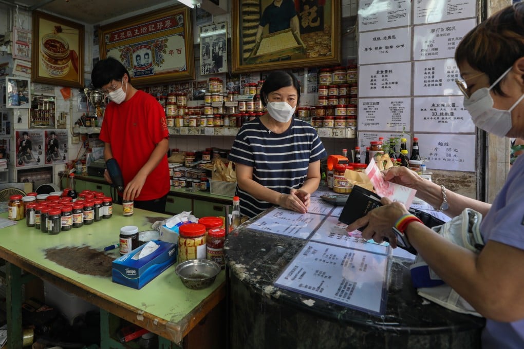 Jay Liu Fong-yip (left) is the fourth generation of his family to work at Liu Ma Kee, a fermented tofu shop founded in 1905 in Hong Kong’s Yau Ma Tei neighbourhood. Photo: Xiaomei Chen