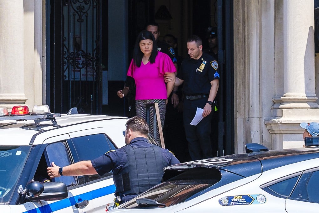 Brooklyn City councilwoman Susan Zhuang is removed by officers from the 62nd Precinct in Bath Beach for transport to Brooklyn Central Booking in New York on Wednesday. Photo: TNS