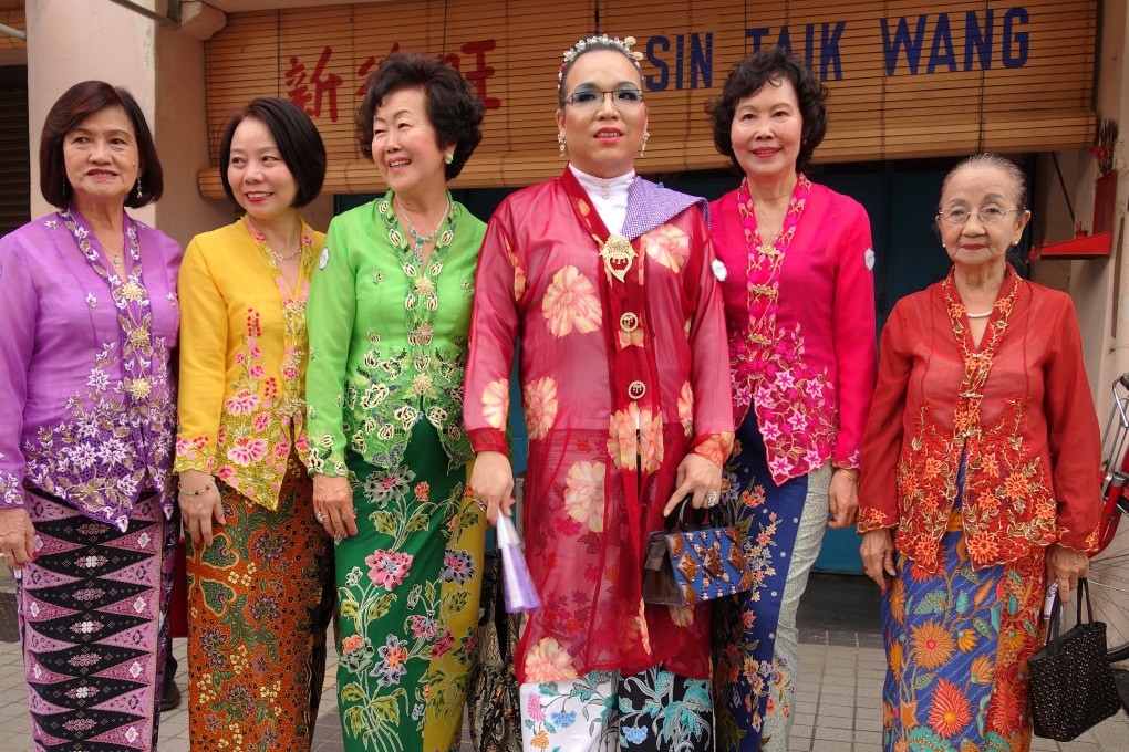 Baba Nyonya pose in Penang, Malaysia, in 2013 as part of a celebration of the conferring by Unesco of World Heritage Site status on the state capital, George Town. Baba Nyonya, or Chinese Peranakans, show the upsides to cultural assimilation. Photo: Shutterstock Images