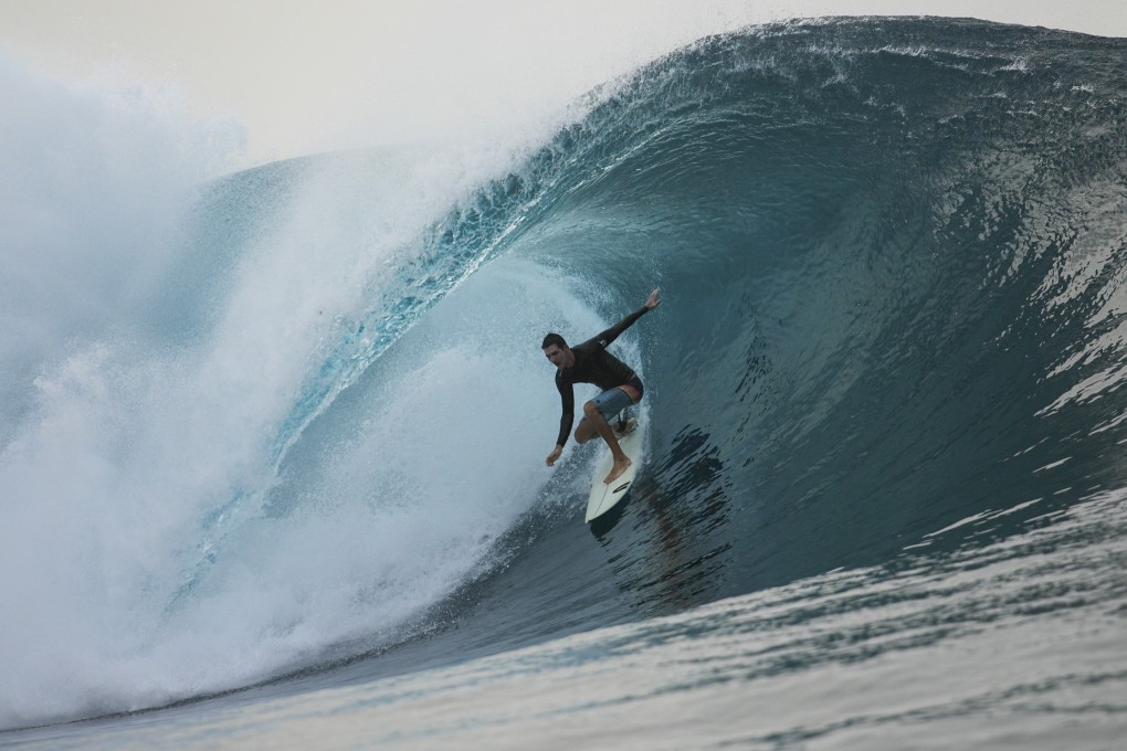 A surfer rides a wave in Teahupo’o, Tahiti, French Polynesia. The world-famous surf spot is set to host the 2024 Paris Olympics surfing competition. Photo: AP