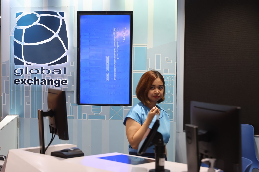 The Microsoft Windows recovery screen displayed at a currency exchange kiosk during a worldwide systems outage at Hong Kong International Airport on Friday. Photo: Edmond So