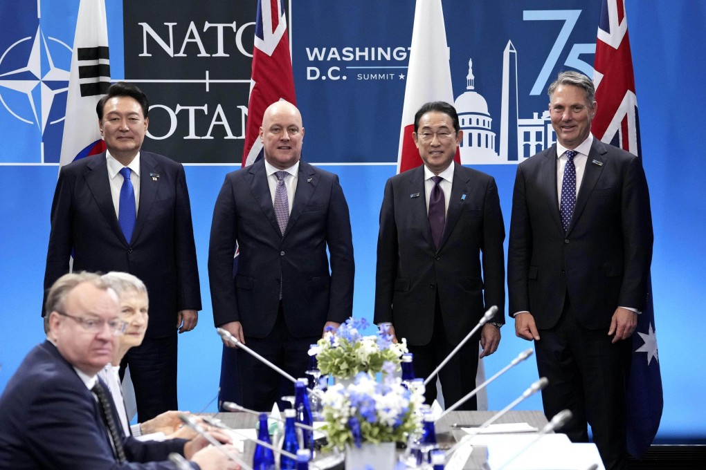 South Korea’s President Yoon Suk-yeol, New Zealand’s PM Cristopher Luxon, Japan’s PM Fumio Kishida and Australia’s Deputy PM Richard Marles pose for photos before a meeting of NATO’s four Indo-Pacific partners in Washington. Photo: Kyodo