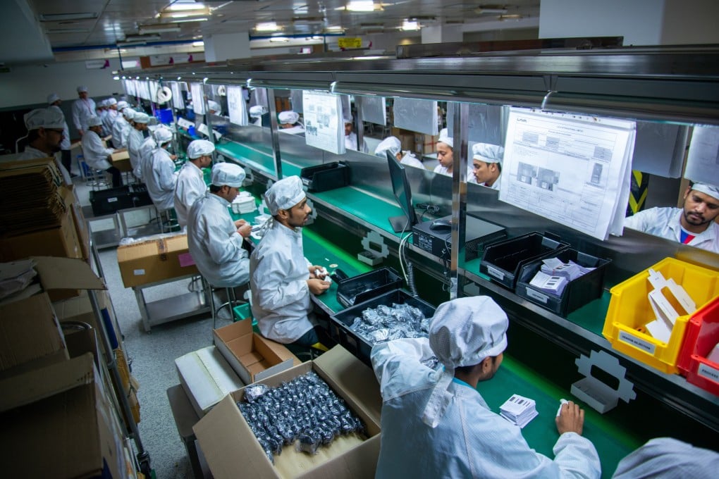 Employees work in a mobile phone factory in Noida, India. New Delhi is considering adjusting import tariffs on mobile phone parts as part of its review of the Asean free-trade deal. Photo: Shutterstock