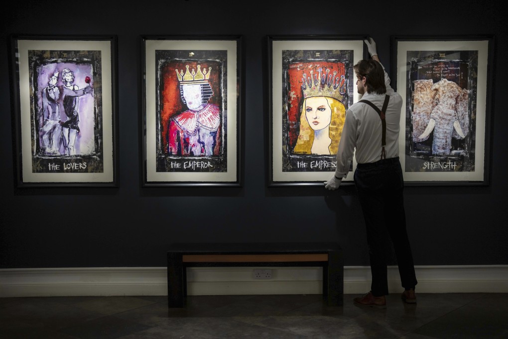 A collection of paintings titled Tarot by actor Johnny Depp are displayed at Castle Fine Art gallery in London ahead of their sale. The paintings reflect chapters in the actor’s personal journey. Photo: Scott A Garfitt/Invision/AP