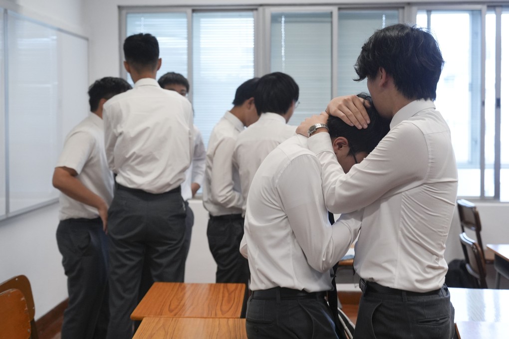 Students of a secondary school in Hong Kong react to their DSE results on July 17. The annual “grand reveal” is a stark reminder of the intense academic pressures our young people face. Photo: Eugene Lee