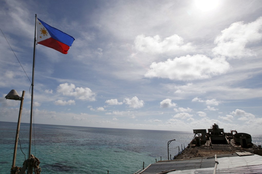 A Philippine flag flutters on the BRP Sierra Madre, a dilapidated Philippine Navy ship that has been grounded on the disputed Second Thomas Shoal since 1999. Photo: Reuters