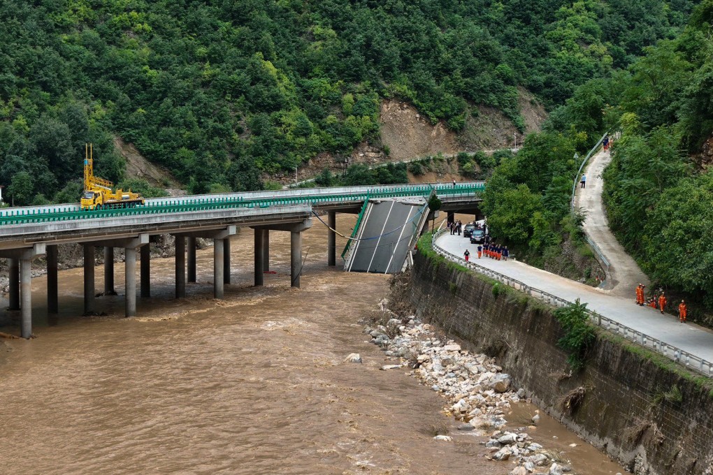 A portion of the bridge on Danning highway in China’s northwestern Shaanxi province lies submerged after collapsing on Friday night. Photo: Xinhua