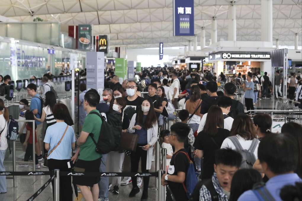 The city’s airport services slowed to a crawl when airlines were forced to resort to processing passengers manually. Photo: Xiaomei Chen