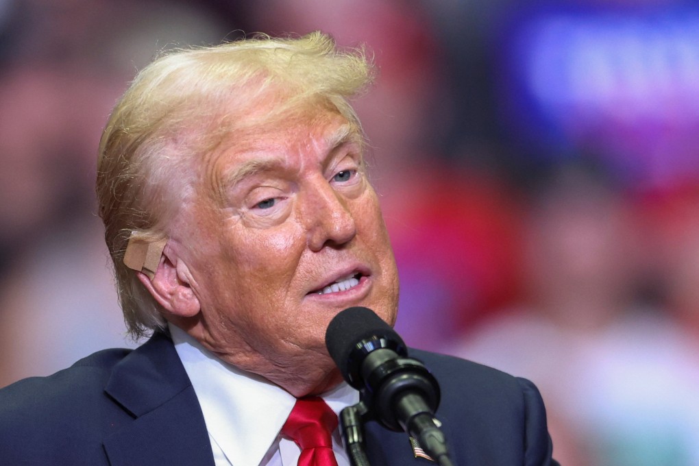 Republican US presidential nominee Donald Trump wears a flesh-coloured bandage on his ear as he holds a campaign rally in Grand Rapids, Michigan, on Saturday. Photo: Reuters