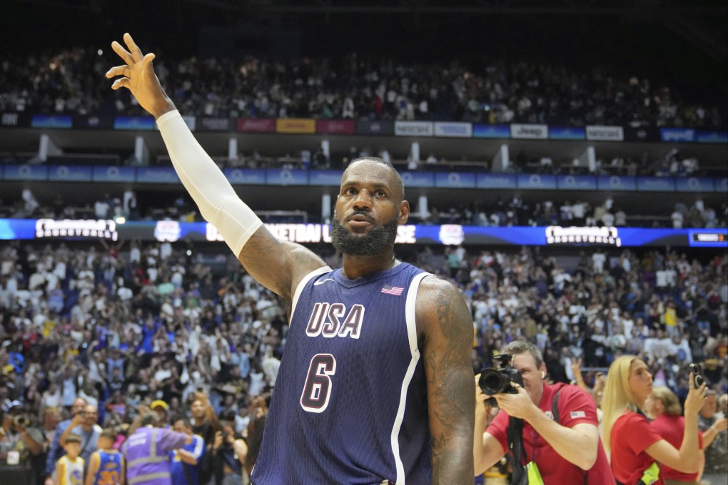 LeBron James waves to the crowd after his points helped the United States prevent a stunnig upset against South Sudan in an Olympic warmup match. Photo: AP