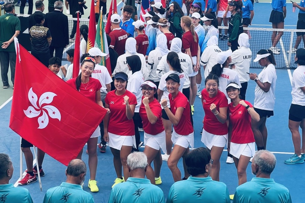 Hong Kong’s players are elated after clinching promotion in the Billie Jean King Cup on Saturday. Photo: HKCTA
