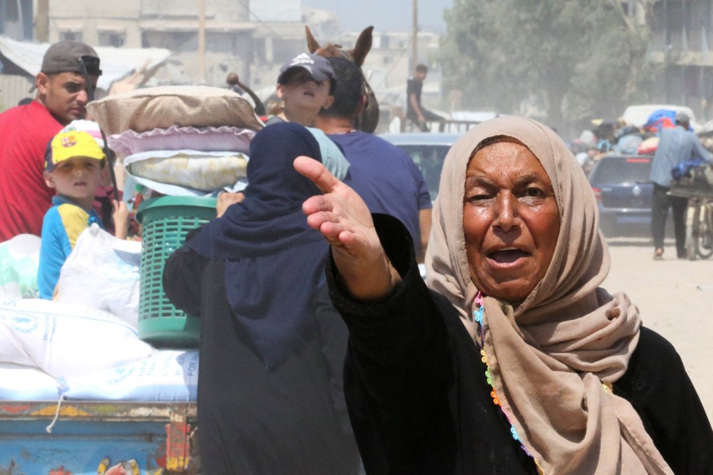 A Palestinian woman gestures as others flee the eastern part of Khan Younis after they were ordered by the Israeli army to evacuate their neighbourhoods on Monday. Photo: Reuters