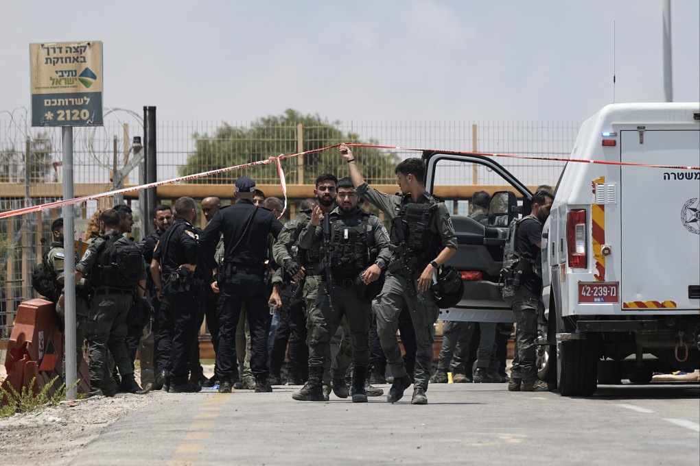 Israeli Police investigate an attempted stabbing attack at the entrance to Netiv Haasara, north of the Gaza border in southern Israel on Monday. Photo: AP