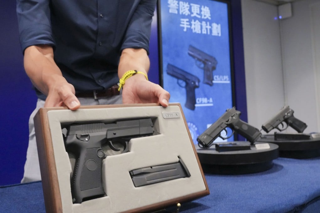 The 9mm CF98-A pistols (left) with a 15-round capacity are displayed at a press conference at police headquarters in Wan Chai. Photo: May Tse