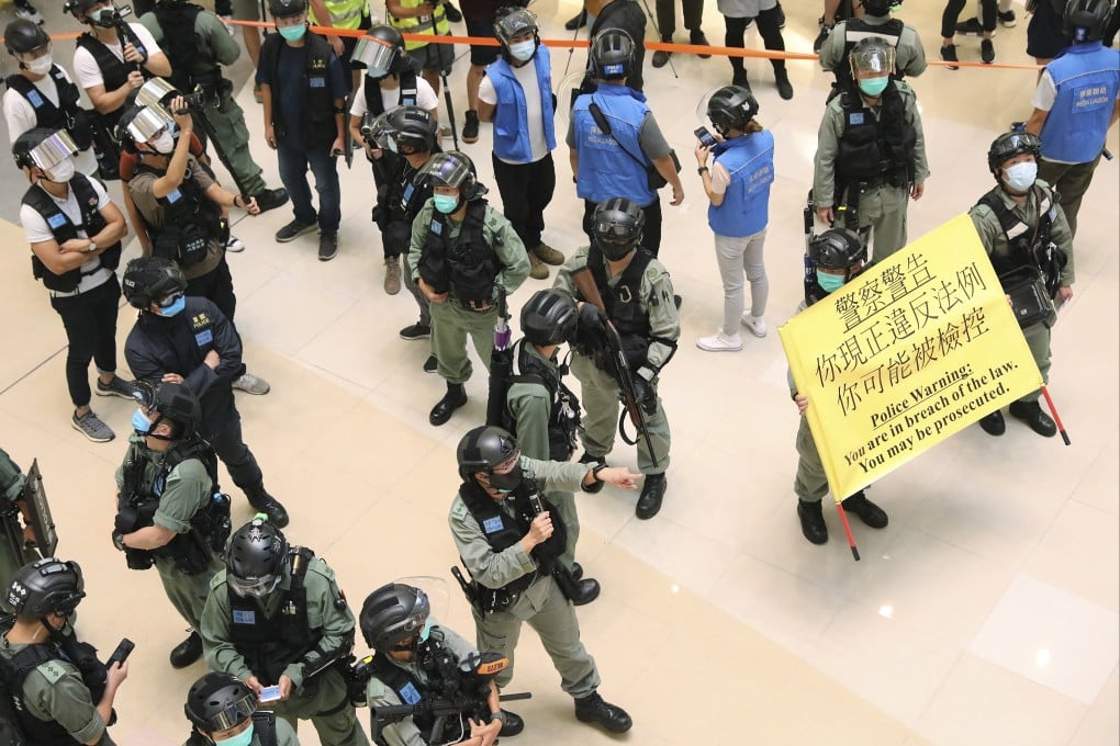 Police officers in riot gear at Kwun Tong’s APM shopping centre. Photo: K. Y. Cheng