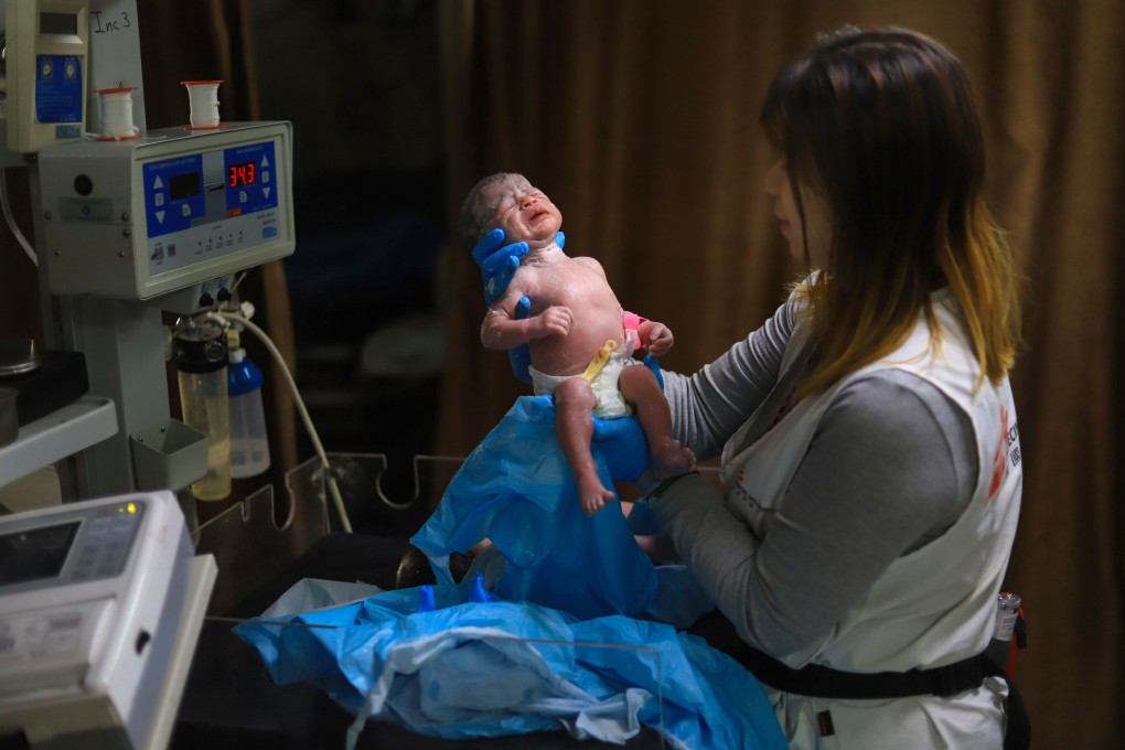 Nurse Krystal So checks on a newborn baby at Gaza’s Nasser Hospital. Photo: Handout