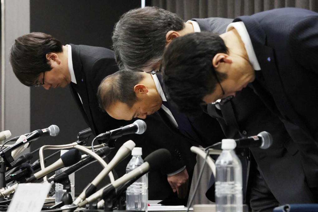 Kobayashi Pharmaceutical president Akihiro Kobayashi (second from left) and other officials bow at a press conference on the health scare surrounding the company’s products in March. Photo: Jiji Press/ AFP