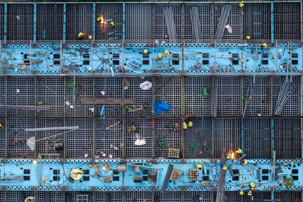 Aerial photo taken on October 29, 2023 shows workers working at the construction site of the electric furnace green energy saving and quality improvement technical transformation project of Jiangsu Shagang Group Huigang Special Steel in Huai ‘an city, Jiangsu Province, China. Photo: Getty Images