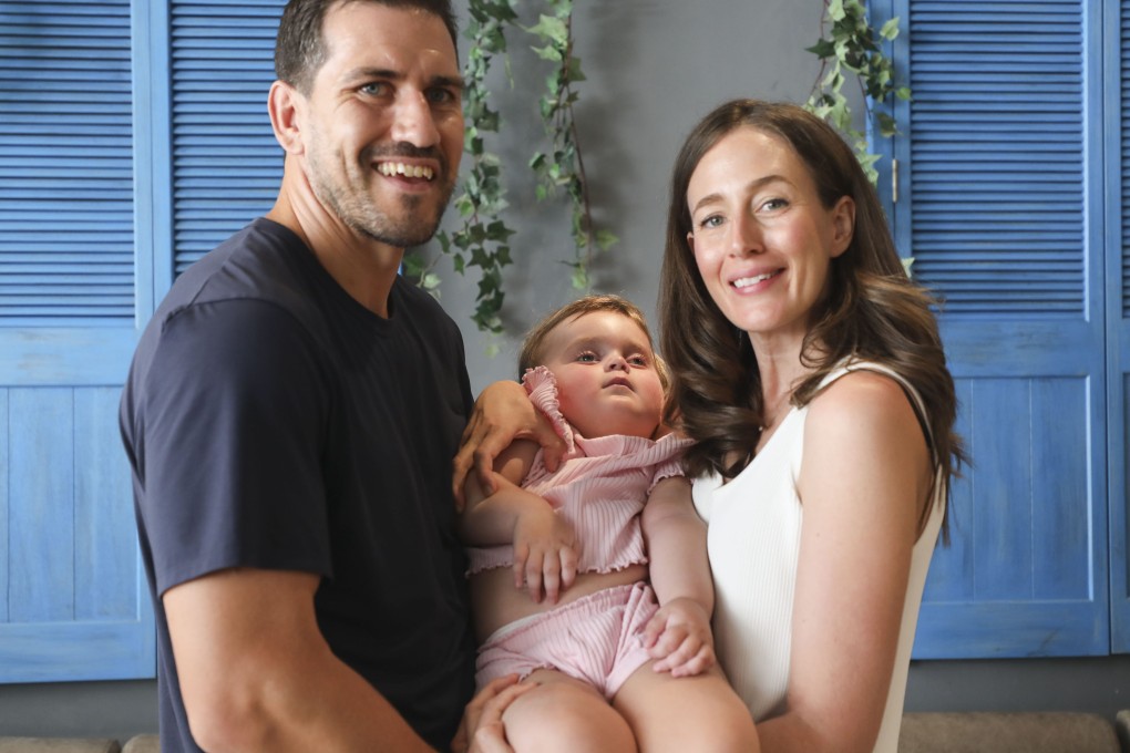 Freya Maclay, 23 months old, who has Tay-Sachs disease, with her parents, Ally and Simone Maclay, in Central, Hong Kong. The disease is rare and incurable, and the couple have been raising awareness of it, and funds for research. Photo: Xiaomei Chen