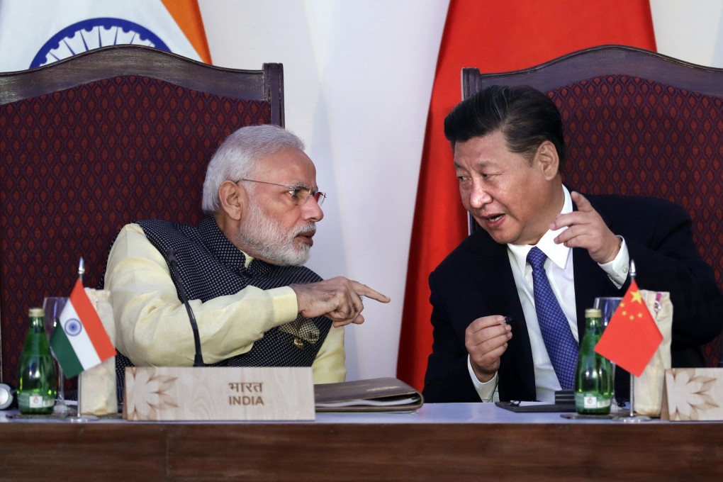 Indian Prime Minister Narendra Modi, left, talks with Chinese President Xi Jinping at a signing ceremony by foreign ministers during the BRICS summit in Goa, India, in 2016. Photo: AP