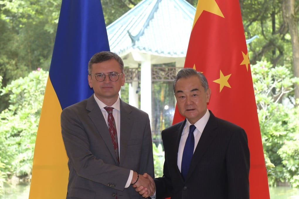 Ukrainian Foreign Minister Dmytro Kuleba (left) poses with Chinese counterpart Wang Yi on Wednesday at Guangzhou’s Pine Garden, a former residence of Chinese President Xi Jinping’s father and a venue used to host important officials. Photo: Xinhua via AP