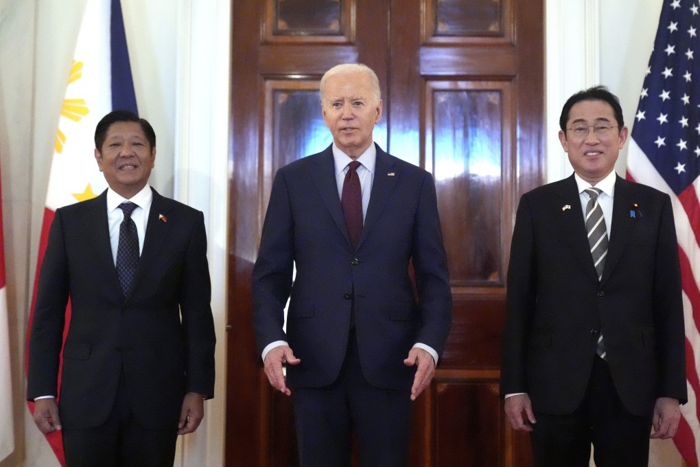 President Joe Biden, center, Philippine President Ferdinand Marcos Jr., left, and Japanese Prime Minister Fumio Kishida pose before a trilateral meeting in the White House in Washington on April 11. Photo: AP