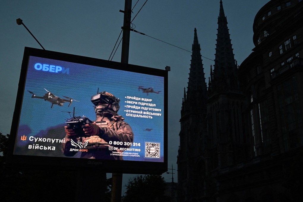 A recruiting placard of Ukraine’s military during a partial blackout in the centre of Kyiv on June 22 amid Russia’s invasion in Ukraine. Photo: AFP