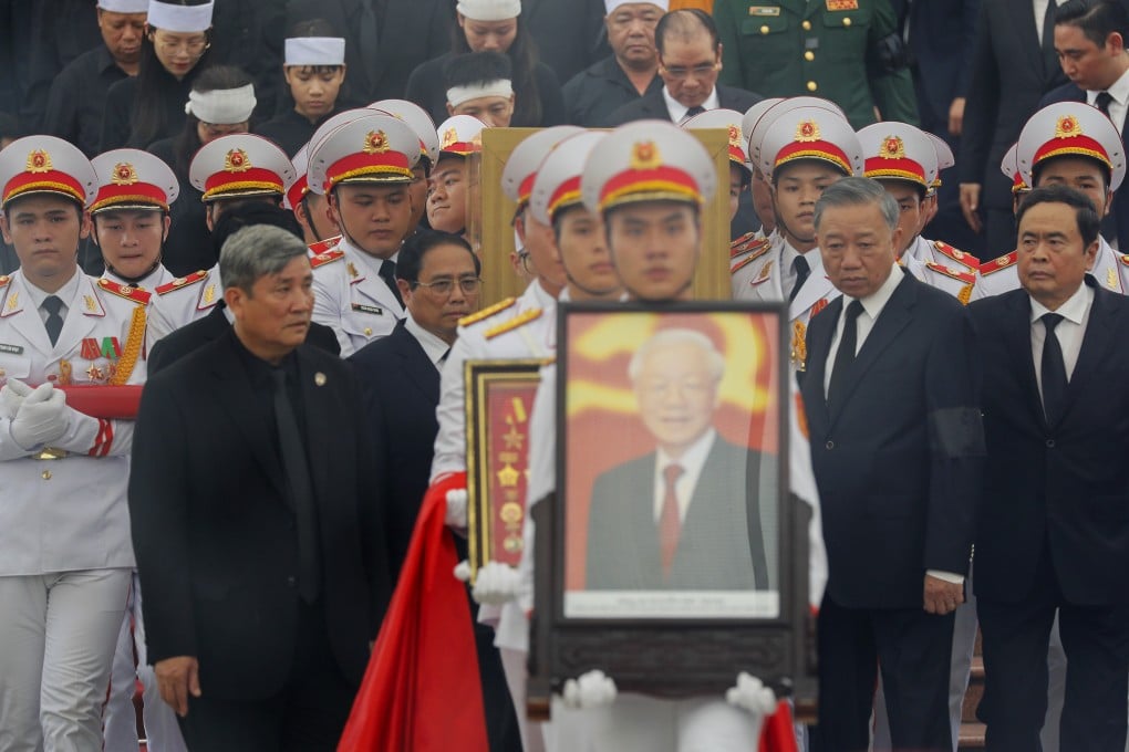A member of Vietnam’s armed forces carries a portrait of the late general secretary of Vietnam’s Communist Party Nguyen Phu Trong during his funeral in Hanoi. The 80-year-old, who died in hospital in the capital last week, led the party since 2011 and oversaw a high-profile anti-corruption drive that swept through the party, police, armed forces and business. Photo: AP