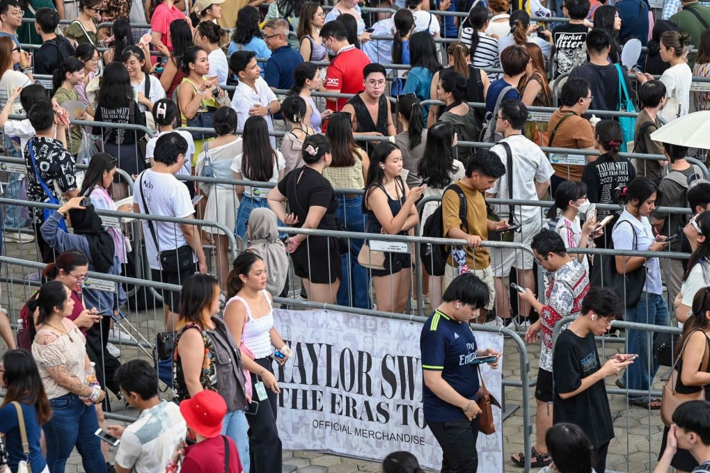 Fans of US singer Taylor Swift line up to buy merchandise before the pop star’s Eras Tour concert at the National Stadium in Singapore in March. Photo: AFP