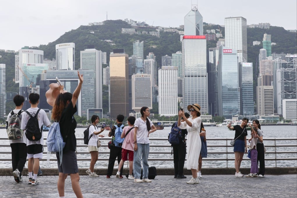 Tourists visit the Tsim Sha Tsui waterfront. Hong Kong has come in 13th place on a list ranking the world’s safest cities. Photo: Jelly Tse