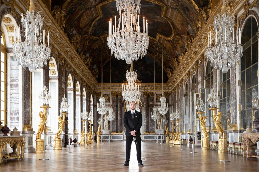 Security guard Hakim in the Hall of Mirrors in the Palace of Versailles will be one of many unseen French workers welcoming 11 million tourists to Paris. Photo: AFP