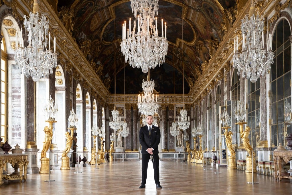 Security guard Hakim in the Hall of Mirrors in the Palace of Versailles will be one of many unseen French workers welcoming 11 million tourists to Paris. Photo: AFP