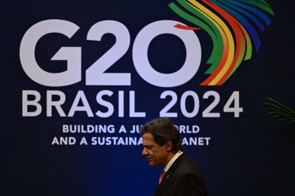 Brazil’s Economy Minister Fernando Haddad arrives for a press conference in Rio de Janeiro on Friday. Photo: AFP