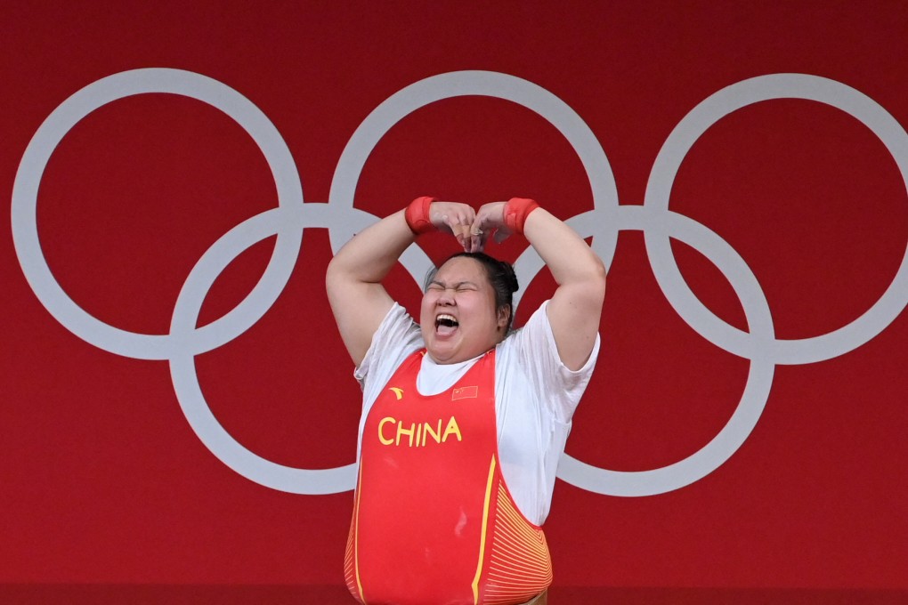 China’s Li Wenwen celebrates in the women’s +87kg weightlifting competition during the Tokyo 2020 Olympic Games. Researchers warn that heat conditions in Paris this summer could be worse than they were during the last Games. Photo: AFP