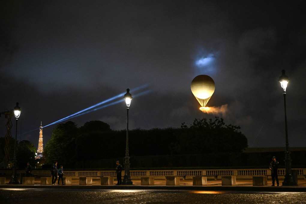 The cauldron, with the Olympic flame lit, lifts off while attached to a balloon during the opening ceremony of the 2024 Paris  Olympic Games. Photo: AFP