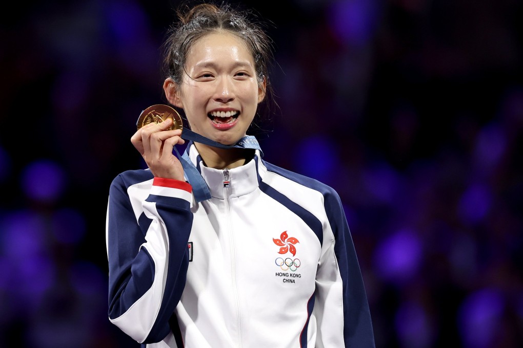 Vivian Kong poses with her gold medal after winning the women’s individual epee at the Paris Olympics. Photo: EPA-EFE