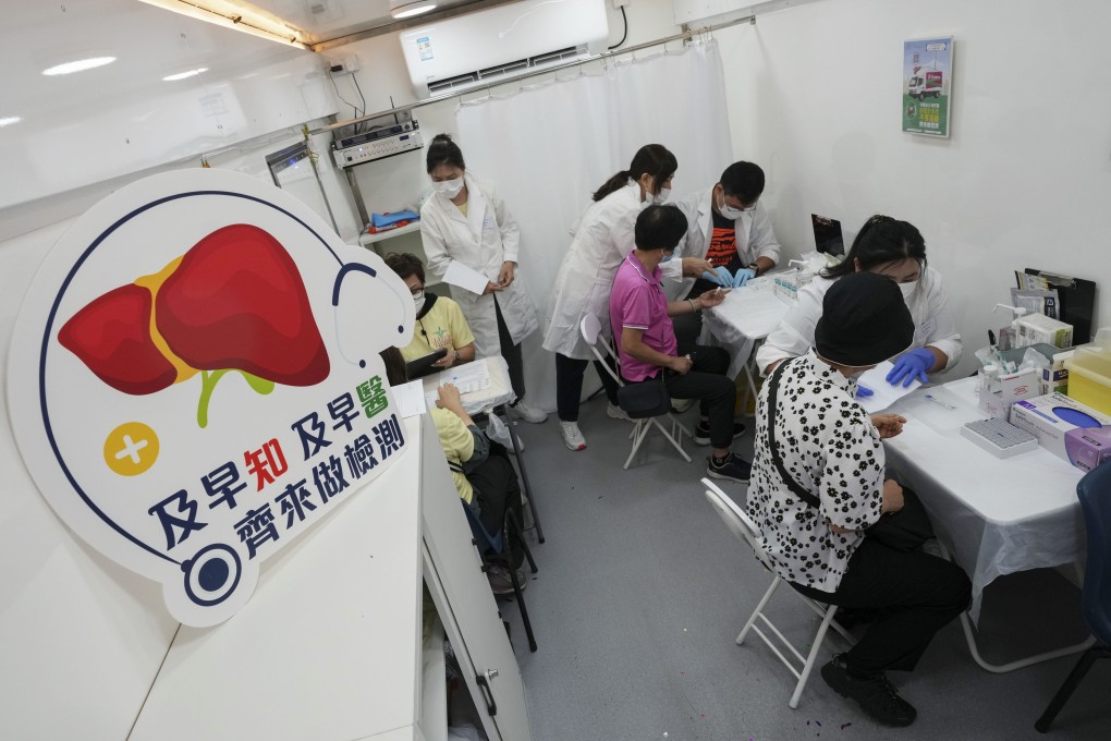 People get quick tests for hepatitis B in a new mobile clinic launched on World Hepatitis Day. Photo: Elson Li