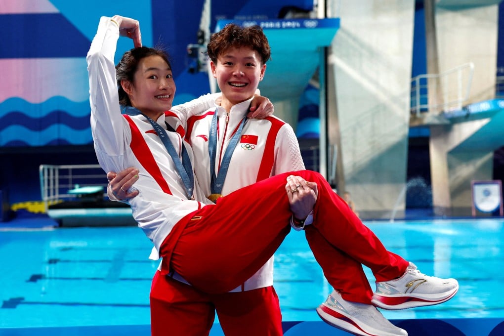 Chang Yani (left) and Chen Yiwen (right) show their closeness in the celebrations after winning synchronised diving gold medals in Paris. Photo: Reuters