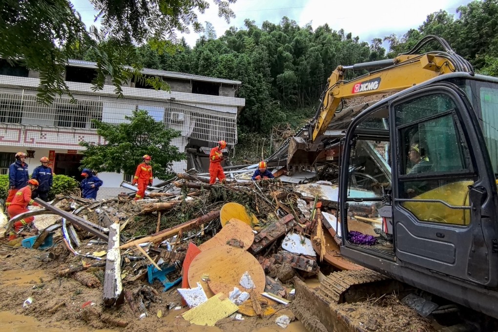 Rescuers clean debris after a landslide desvastated Yuelin village in Hunan province on Sunday. Photo: EPA-EFE /Fire and Rescue Department of Hunan handout via Xinhua