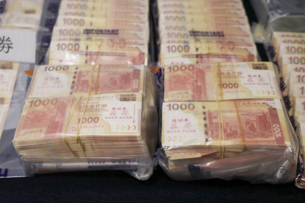 Stacks of bogus bank notes displayed as evidence. Police say the masterminds impersonated a well-known cryptocurrency investor. Photo: Jelly Tse